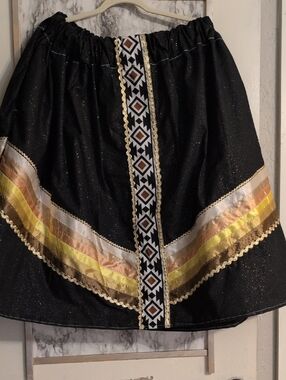 Black Metallic Glitter Native Ribbon Skirt with Gold & Yellow Trim.